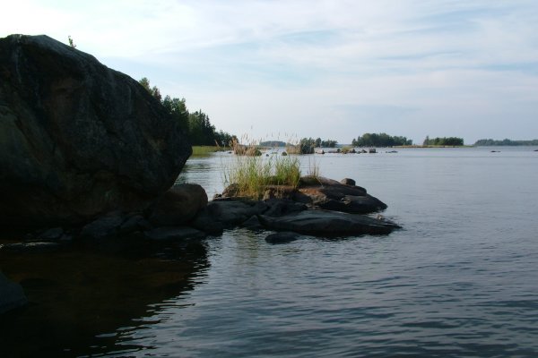 A view into the Ostrobothnian archipelago in Västervik outside of Vasa. The boulder together with the other stones left here by the inland ice of the iceage makes an interesting view with tree covered islands spread out in the background.