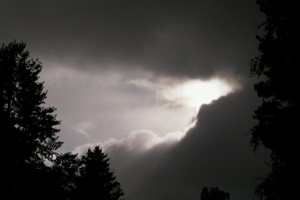 The first rays of light can be seen peeking out from behind the dark clouds after an hour of heavy rainfall in Vstervik, Vasa.